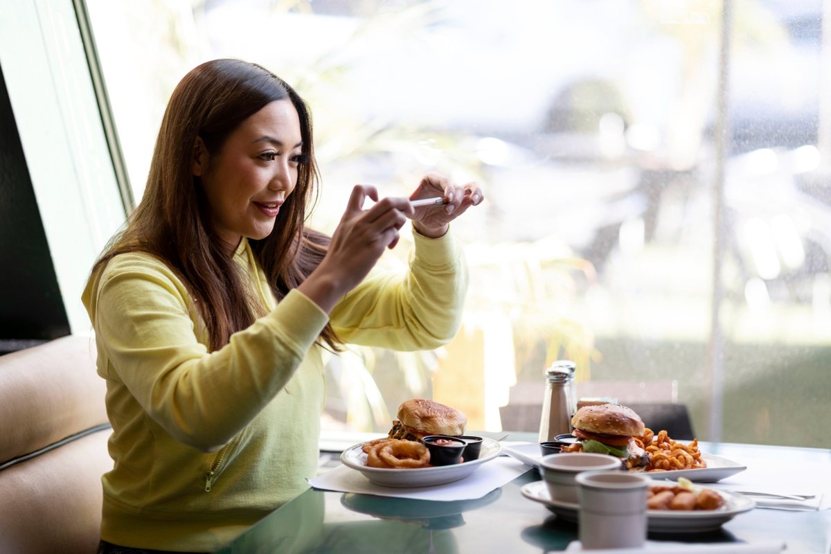 Person capturing a restaurant table